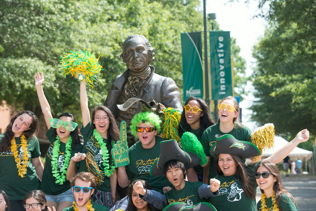 "Incoming freshman students pose at the Mason Statue as the Office of Orientation and Family Programs and Services hosts Freshman Orientation at the Fairfax Campus. Photo by Alexis Glenn/Creative Services/George Mason University"